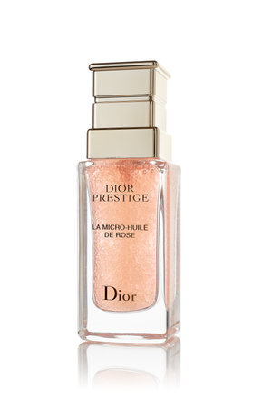 St.Petersburg, Russia - March 2020 - Bottle of rose oil Dior Prestige La micro-huile de rose on white background. Product  from Christian Diorのeditorial素材