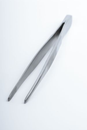 surgical clamps on a soft blue background の写真素材