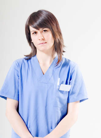 Friendly nurse looking seriouslyの写真素材