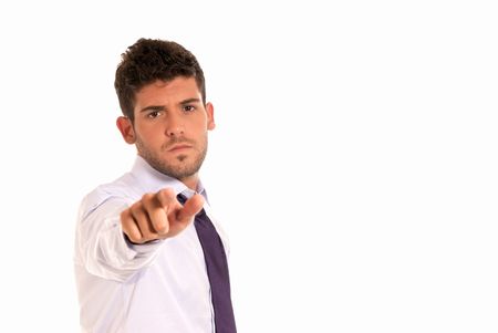 young businessman pointing to camera with copy-space isolated on white backgroundの写真素材
