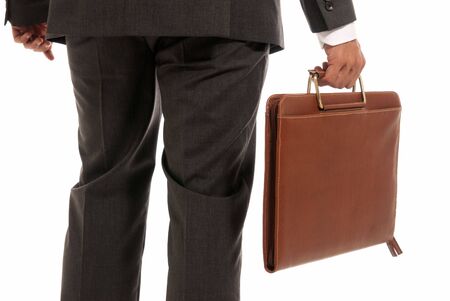 Unrecognizable businessman back with suitcase isolated on white backgroundの写真素材