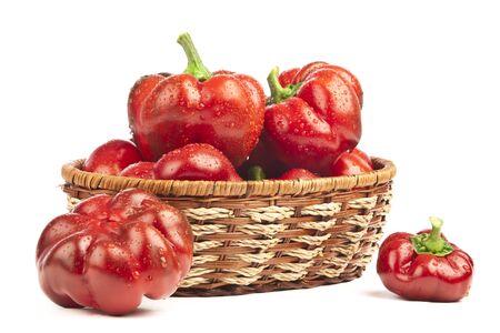 Red pepper in basket on white backgroundの写真素材