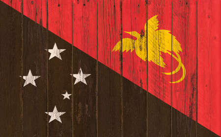 Flag of Papua New Guinea painted on wooden frameの写真素材