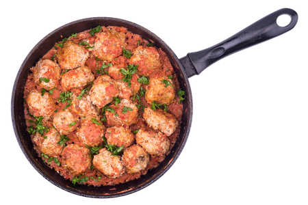 Stewed meatballs in a pan isolated on white background. Top view.の写真素材