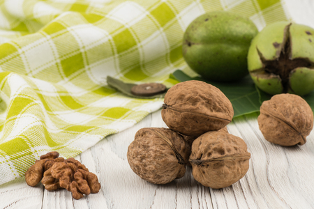 Walnut closeup on an old white wooden table. Selective focus.の写真素材