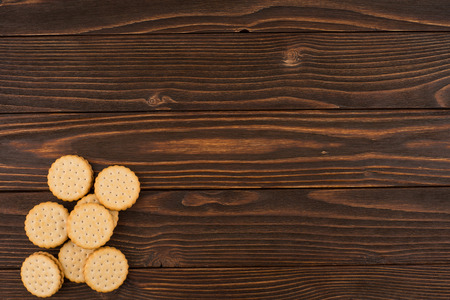 Cookies on the old wooden table. Top view.