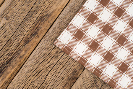 Tablecloth on wooden background,with copy space. Top view.の写真素材