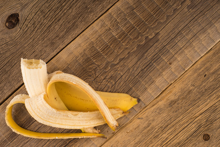 Fresh bananas on wooden backgroundの写真素材