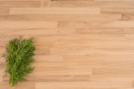 Dill on a wooden backgroundの写真素材