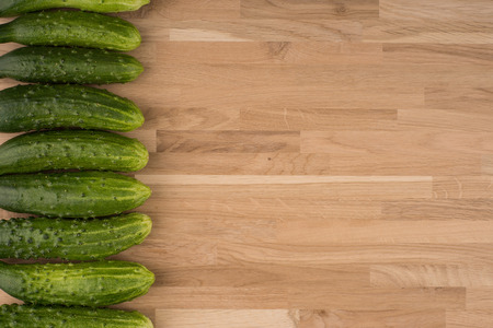 Cucumbers on a wooden background.の写真素材