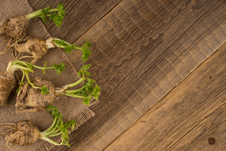 Celery root on the old wooden backgroundの写真素材