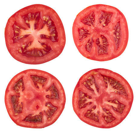 Tomato slice isolated on white background, top viewの写真素材