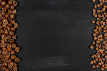 Hazelnuts  on the chalkboard. Top view.の写真素材