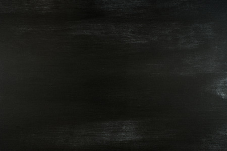 Chalk rubbed out on blackboard. Abstract background, empty template.の写真素材