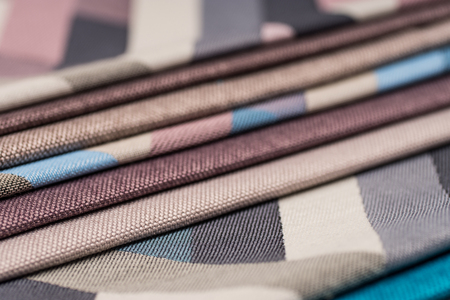 Colorful upholstery fabric samples background. Abstract background, empty template.
