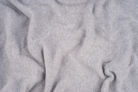 close up grey knitted pullover background. Top view.の写真素材
