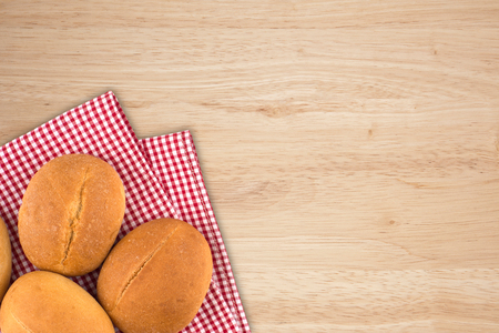 Buns on old wooden table. Top view.の写真素材