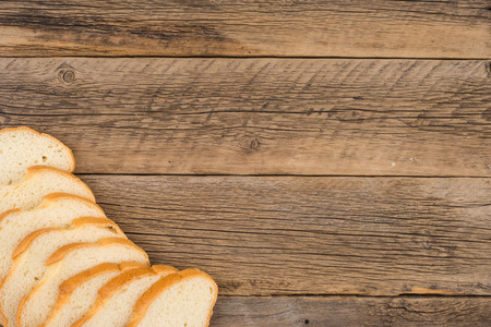 Loaf of bread on a wooden table. Top view.の写真素材