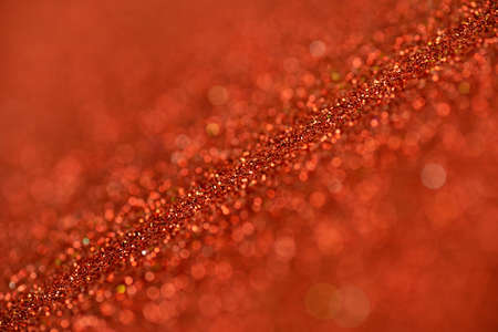Red glitter texture christmas abstract background, Defocused abstract red glitter texture backgroundの写真素材