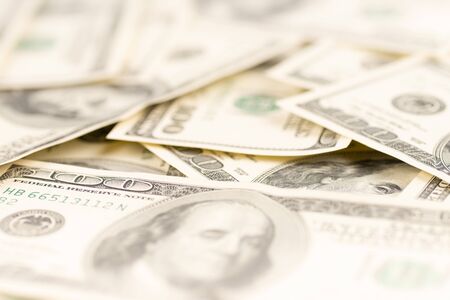 Benjamin Franklin on hundred dollars banknote. Selective focus.の写真素材