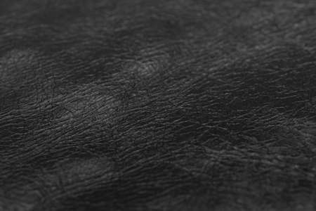 Black cow skin leather texture selective focus for put product, Leather background