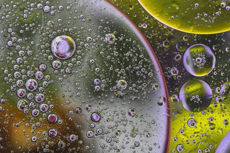 amazingly beautiful oil circles that have a whole world with water and oil.の写真素材