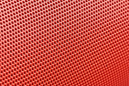 orange metal mesh in macro photography. background. the top is lighter, the bottom is darker. bokehの写真素材