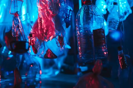 Suspended art objects from the ceiling, painted red and blue creating 3d visualization, abstract background for design. concept of the modern art. cyberpunkの写真素材