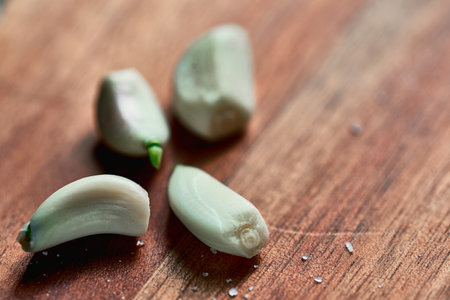 peeled teapot, four slices, lies on a tree surfaceの写真素材