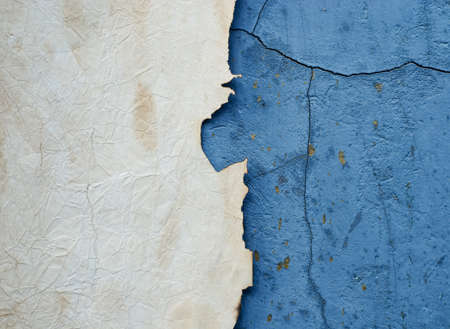 old paper on blue cement wall