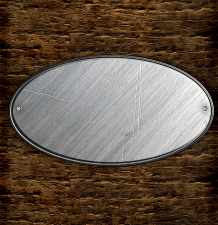 metal sign on wood plank backgroundの写真素材