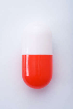 red capsule isolated on white