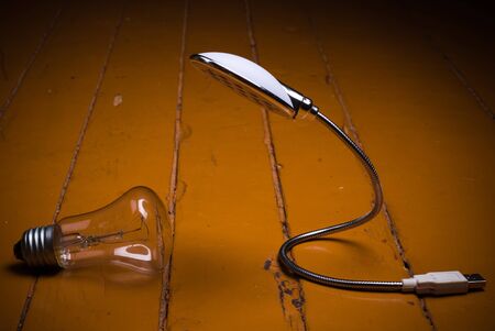 old bulb and led lamp on floor. concept futureの写真素材