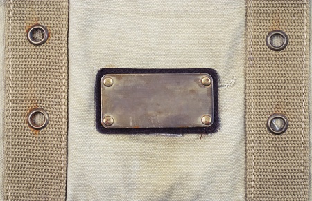metal label on old fabric bagの写真素材