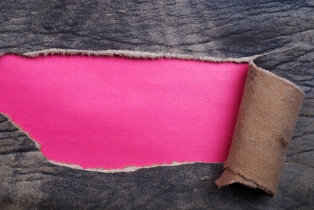 Torn Leather over a purple backgroundの写真素材
