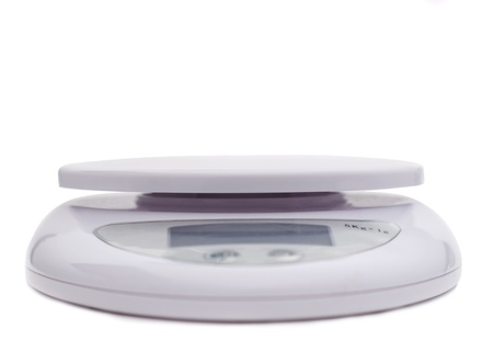 purple table digital scale isolated on whiteの写真素材