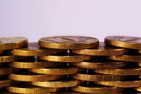 golden piles of coins close up textureの写真素材