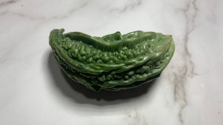 Bitter melon, Bitter gourd isolated on tiles background. Green Vegetablesの写真素材