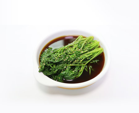 Korean food, seaweed salad with sesame on white backgroundの写真素材