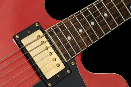 Close up of a red electric guitar