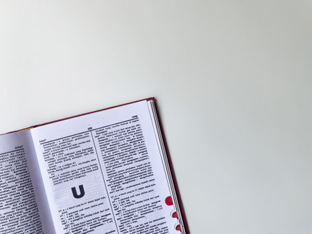 Yogyakarta, Indonesia, 26 Jan 2023 - A book full of Indonesian vocabulary, open on a white table.