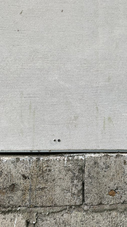 Exposed brick wall with a gypsum partition above.の写真素材