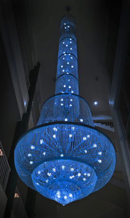 Contemporary glass chandelier isolated over black backgroundの写真素材