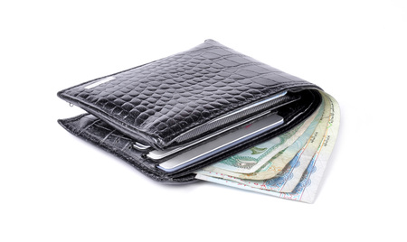 black leather wallet with money isolated on white background の写真素材