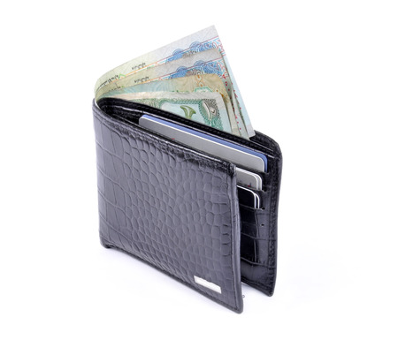 black leather wallet with money isolated on white background の写真素材
