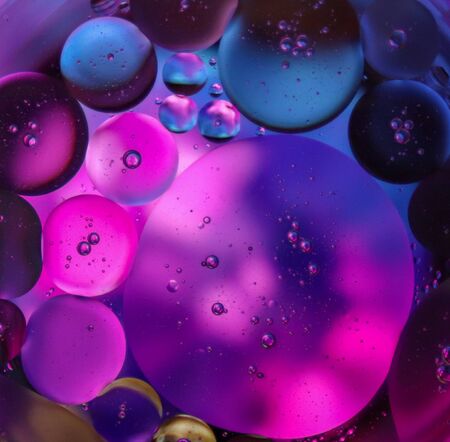 Abstract photography using mixture of oil and water forming a beautiful design of bubbles. Oil and...