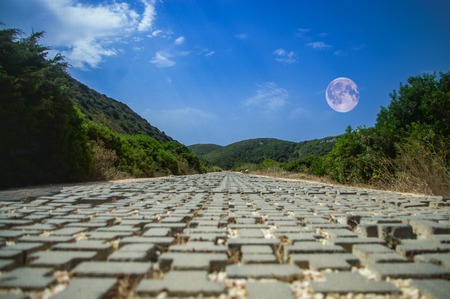 street in daylight with moonの写真素材