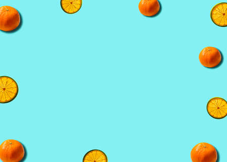 Flat lay citrus concept on a soft blue background