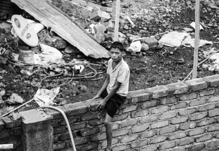 Child worker show his confident in front of lensのeditorial素材