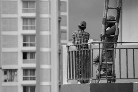 Man thinking about future after done with work, click this image at sunset timeのeditorial素材